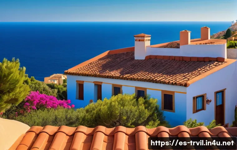 한옥의 기와 종류 - A traditional Mediterranean-style house rooftop featuring curved terracotta clay tiles with warm red...