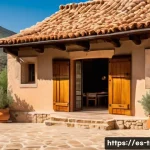 전통주택과 환경 고려 사항 - A traditional Spanish rural house made of adobe, stone, and wood materials, showcasing thick walls a...